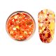 Decorative glitter in vibrant orange color, hexagonal, mixed sizes